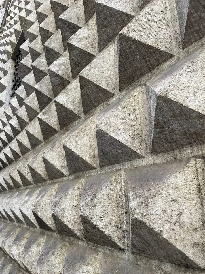 Faceted diamond-point stone facade detail